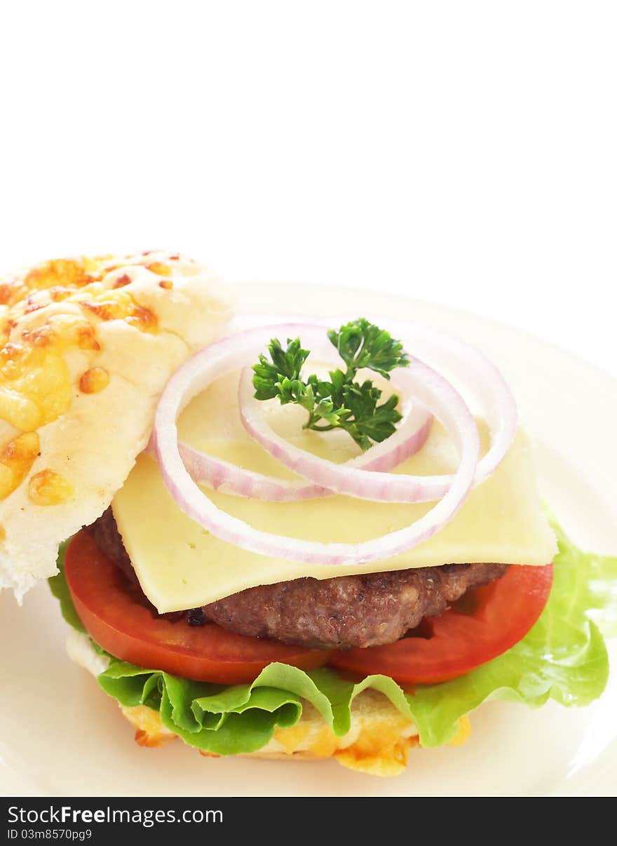 Tasty hamburger with beef patty and tomato