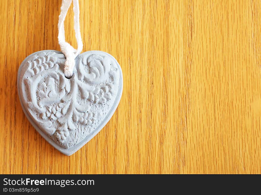 Stone Heart Shape On Wooden Background