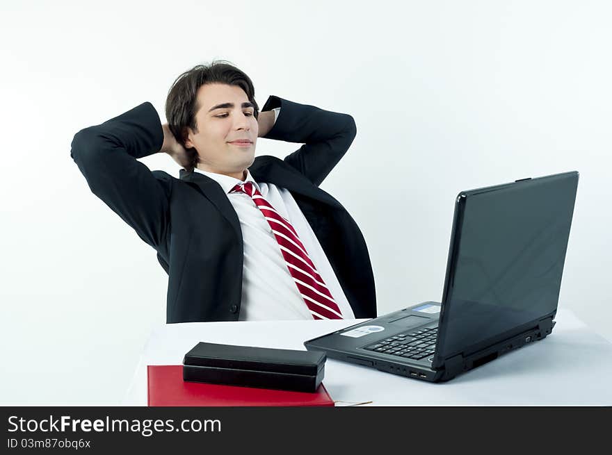 Man taking notes from a laptop on a white background. Man taking notes from a laptop on a white background