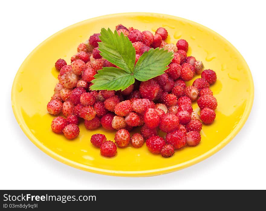 Strawberries on a yellow  plate with green leaf. Strawberries on a yellow  plate with green leaf