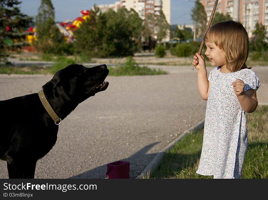 Little girl with dog outside