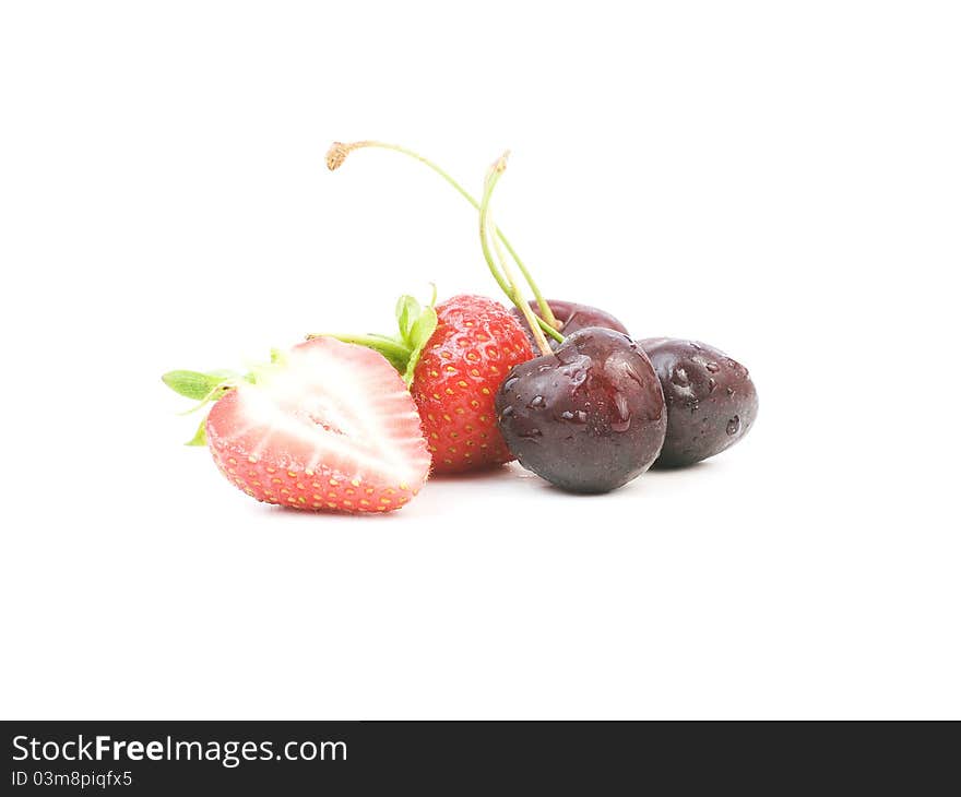 Strawberries and cherries on white background. Strawberries and cherries on white background