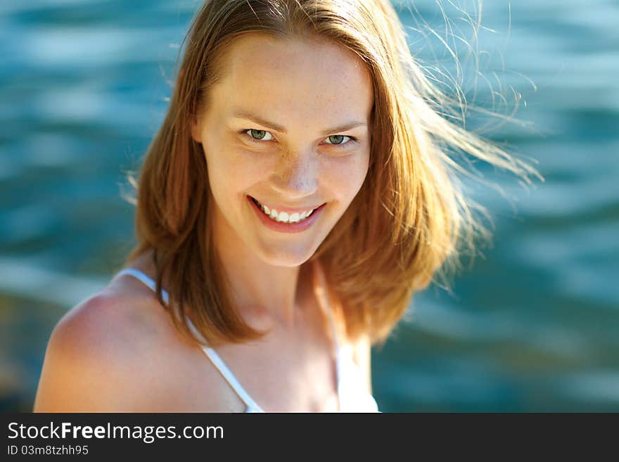 Young woman at the beach on a sunny day