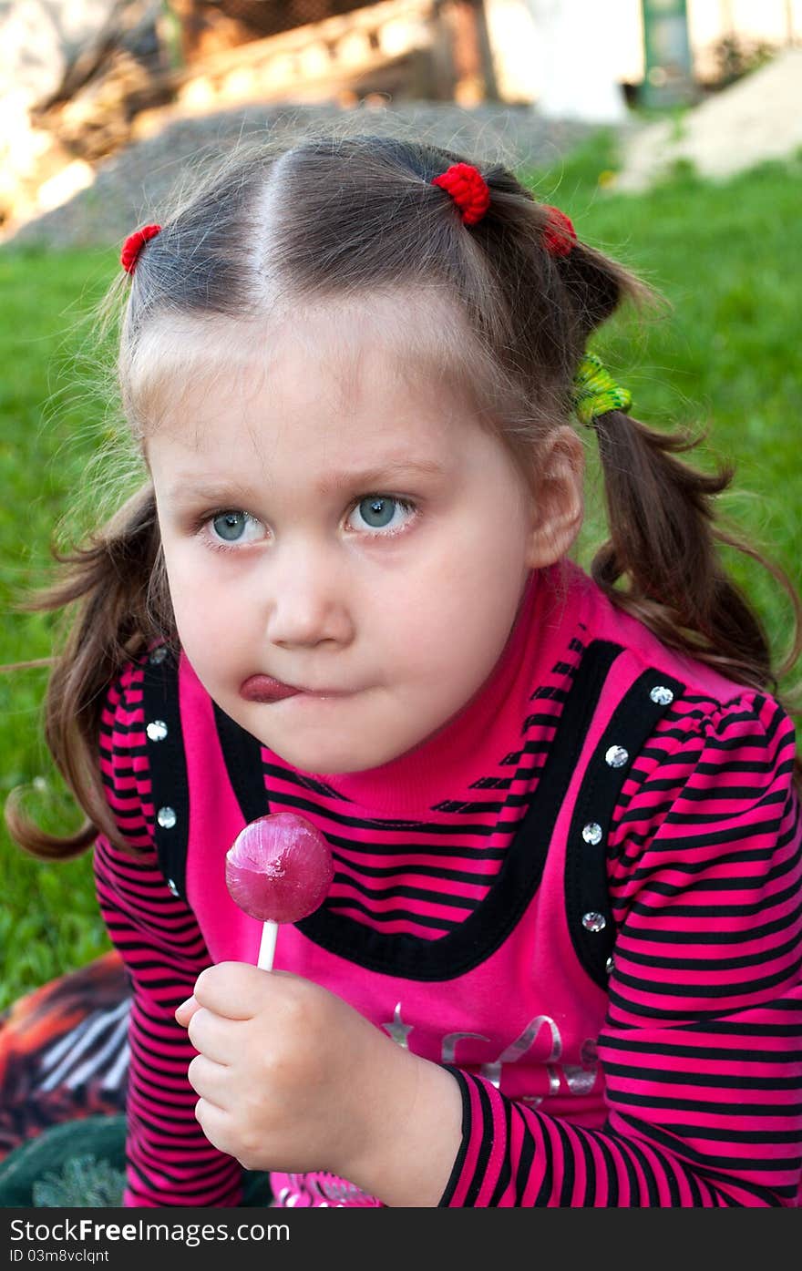 Little girl with candy