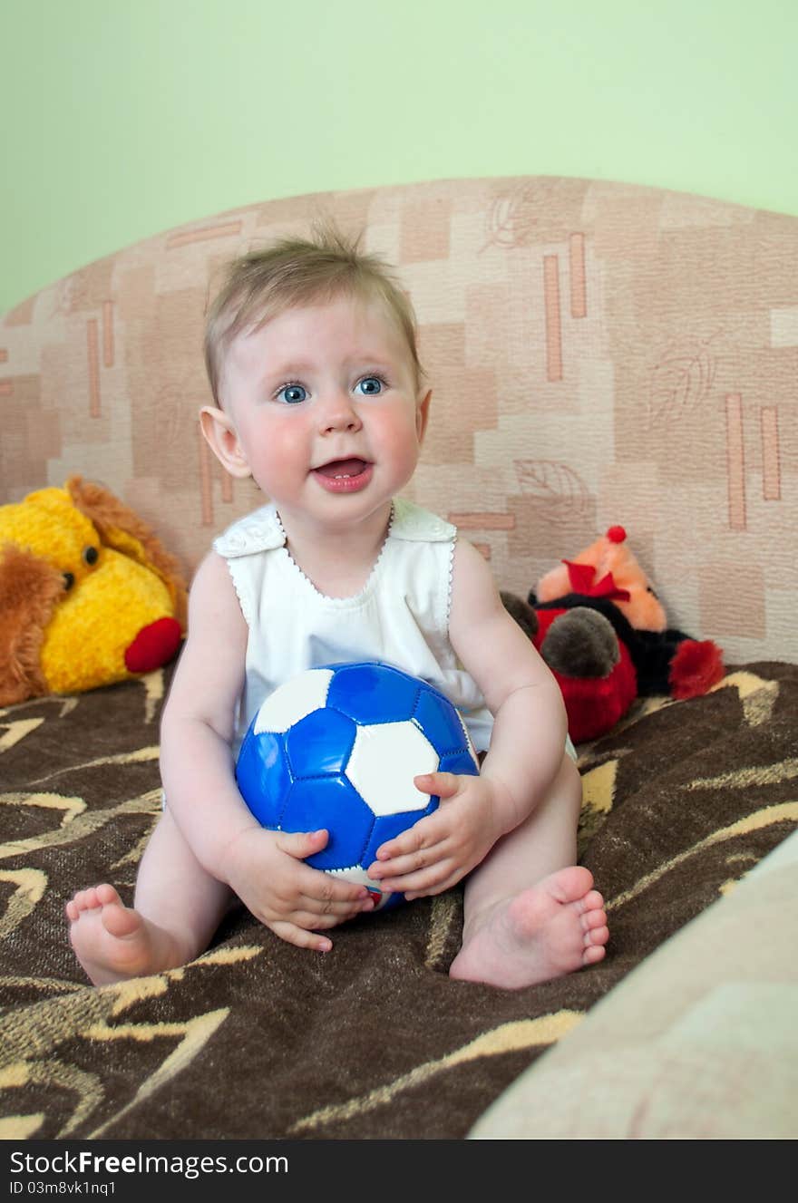 Lovely little girl plays with ball. Lovely little girl plays with ball