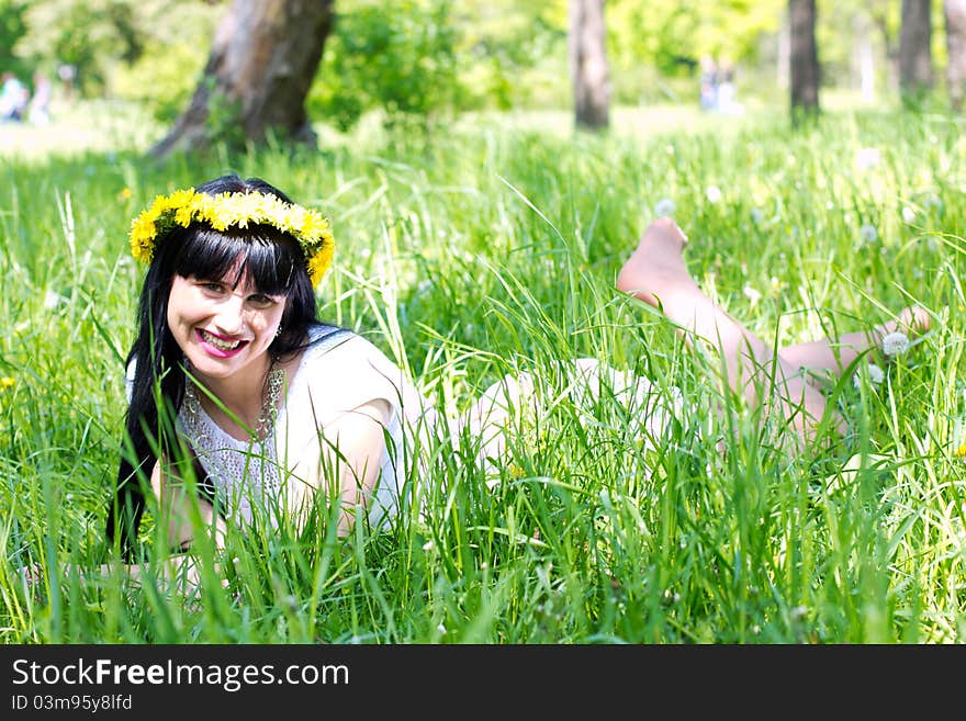 Beautiful woman lying on the grass. Beautiful woman lying on the grass