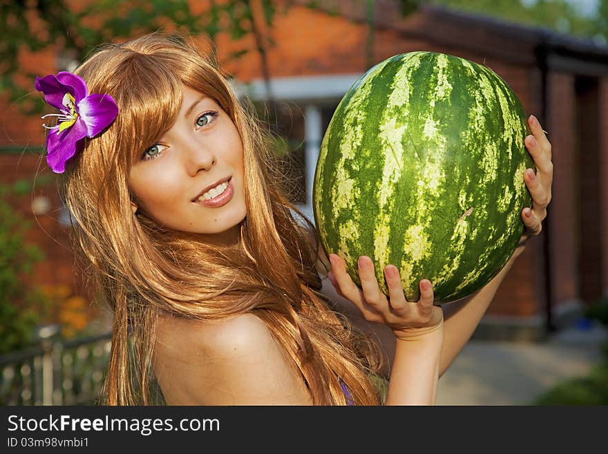 Young woman with watermelon