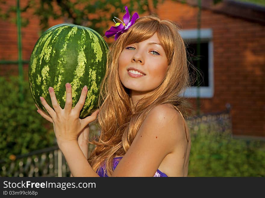 Young woman with watermelon