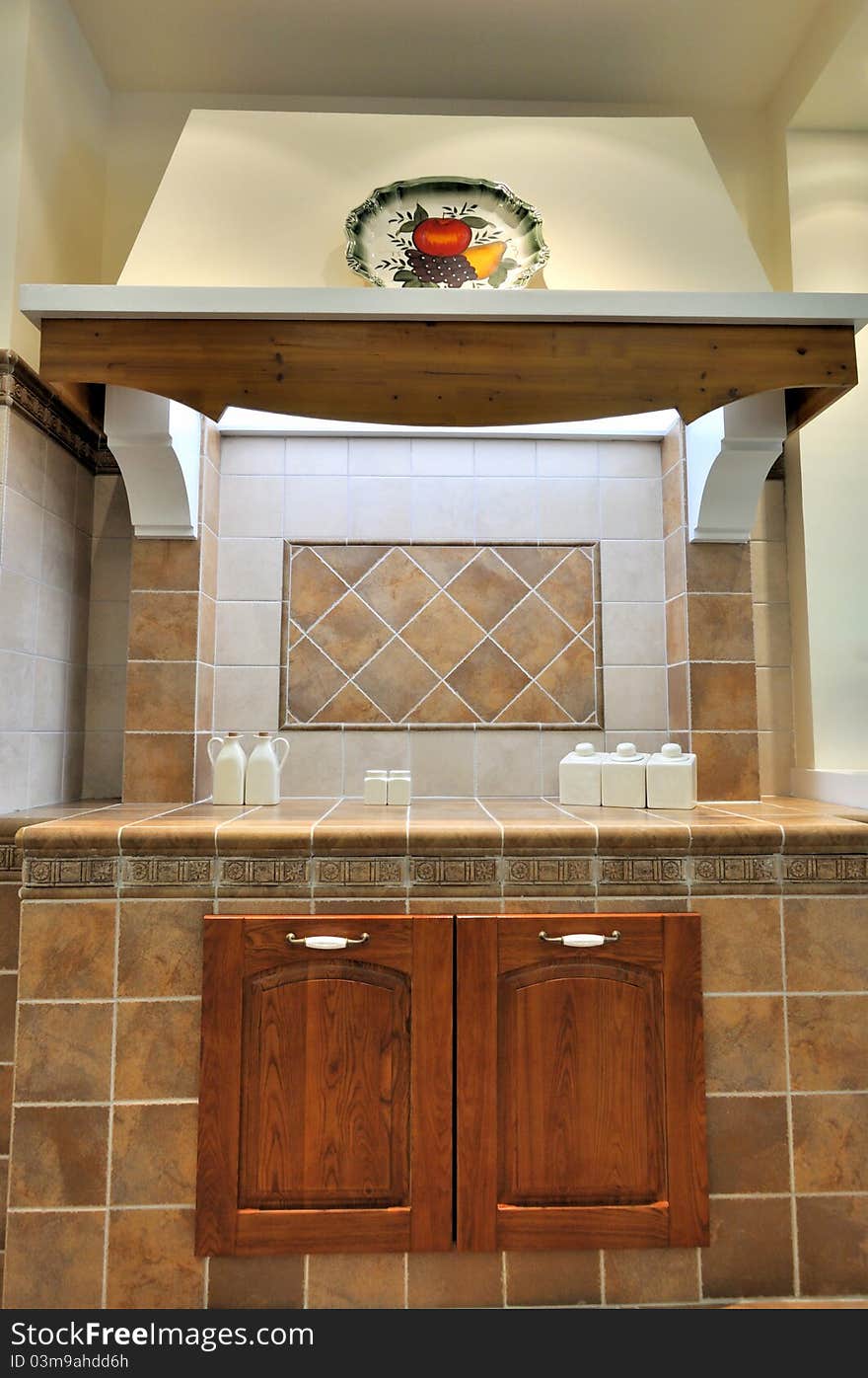 Small and simple kitchen with platform, small seasoning bottles and decoration, shown as functional place and setting in house, and comfortable life style. Small and simple kitchen with platform, small seasoning bottles and decoration, shown as functional place and setting in house, and comfortable life style.