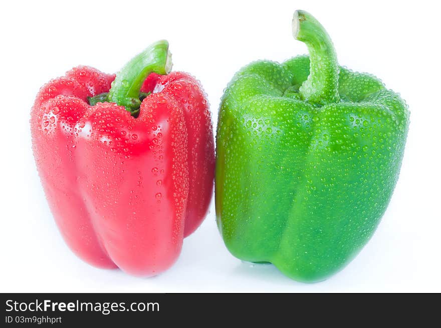 Green and Red Pimento Close-up with droplet of water