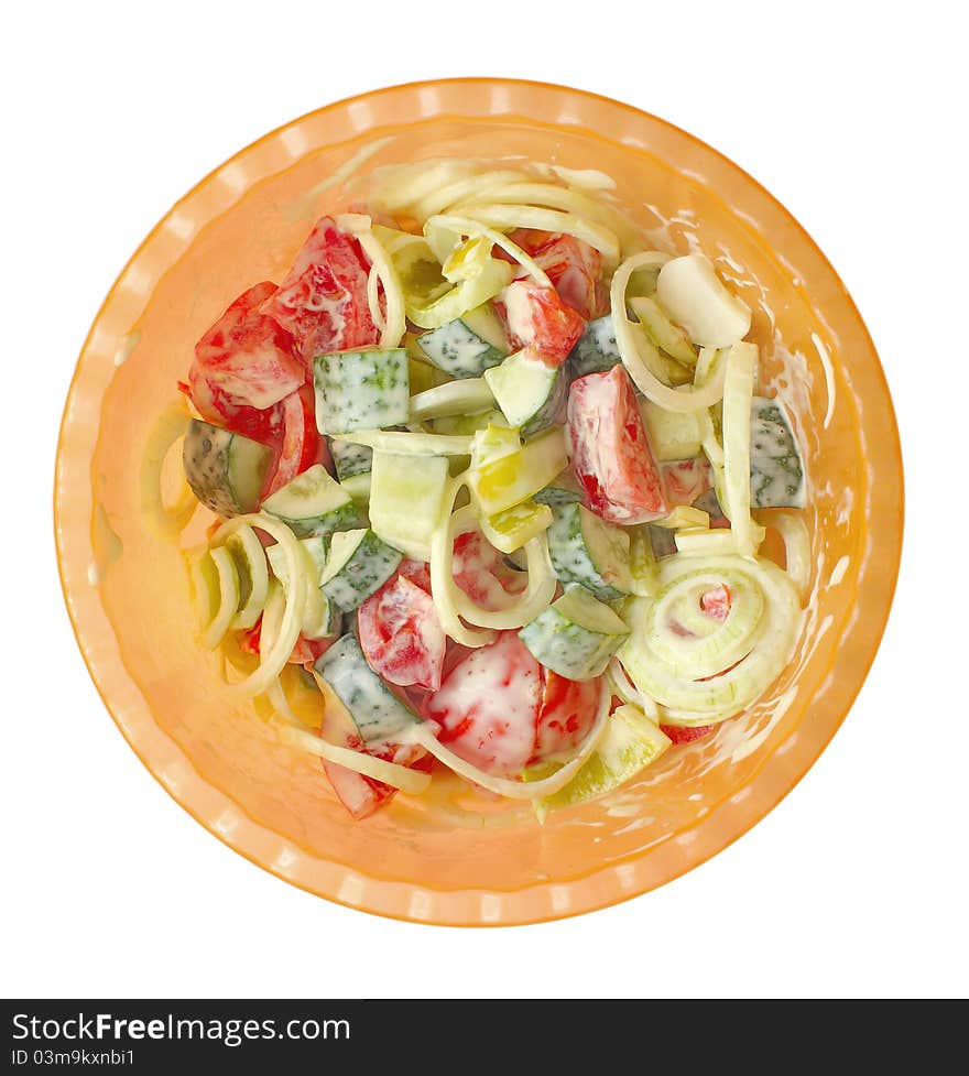 Isolated photo bowls with a summer salad of cucumber, tomato, onion, bell pepper, seasoned mayonnaise.