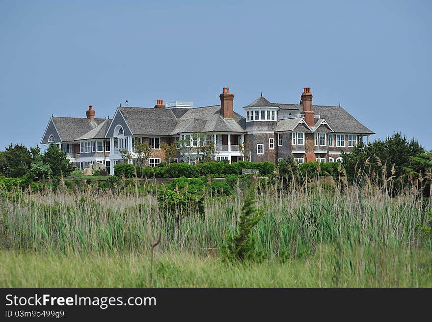 A shot of a summer mansion by the beach. A shot of a summer mansion by the beach