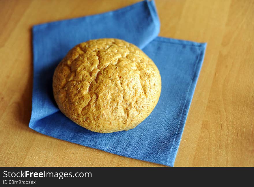 An image of a loaf of fresh bread on a napkin