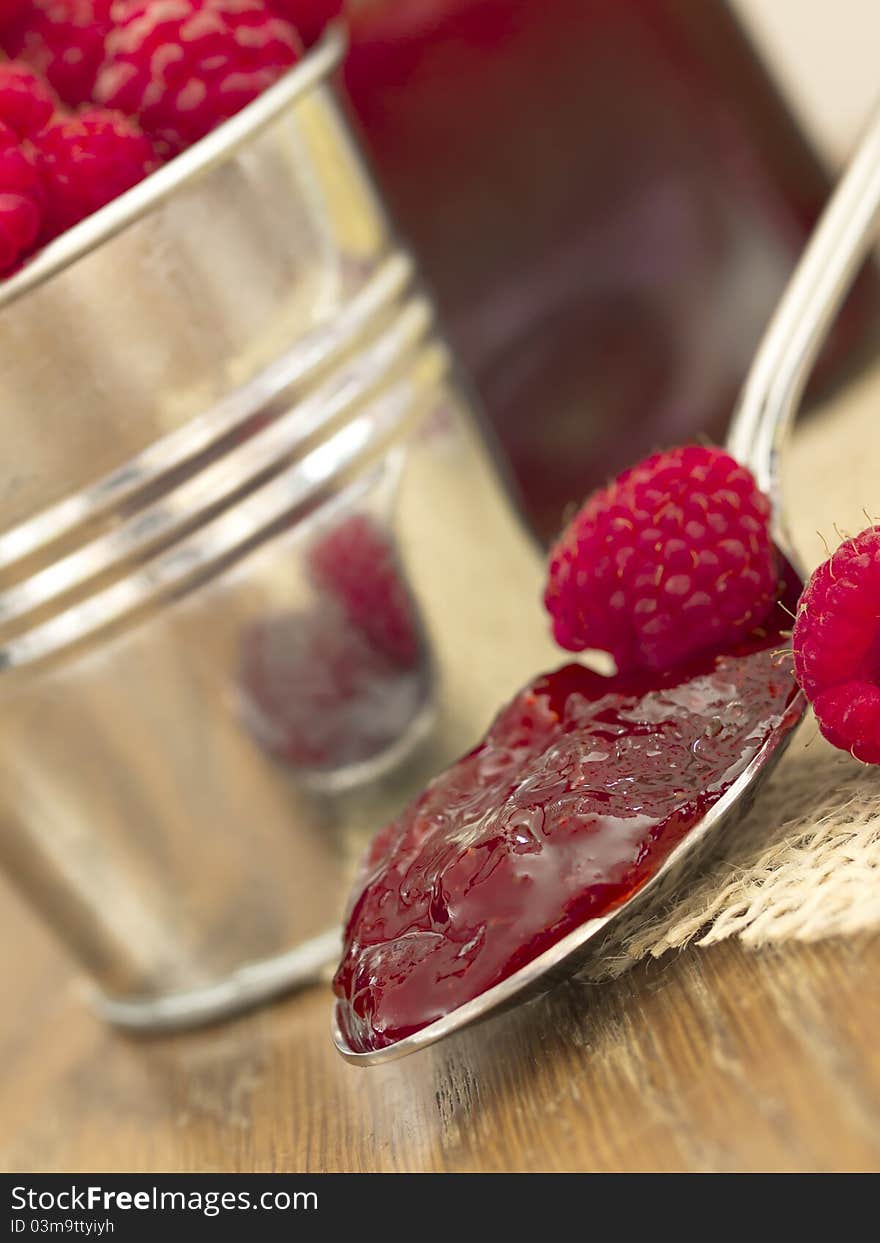 In the metal spoon with fresh rasberries. In the metal spoon with fresh rasberries