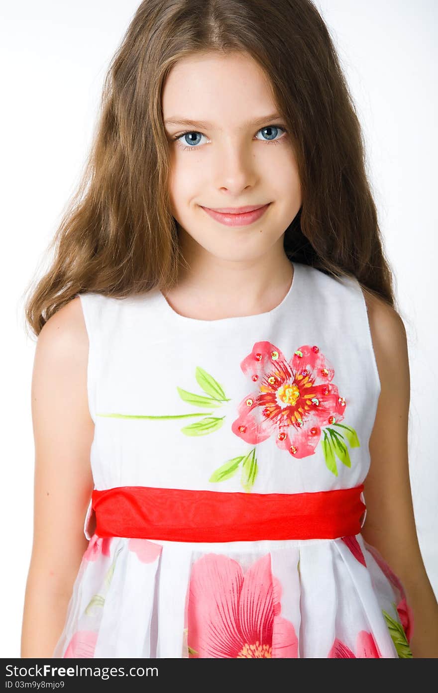 Little girl in red dress on white background