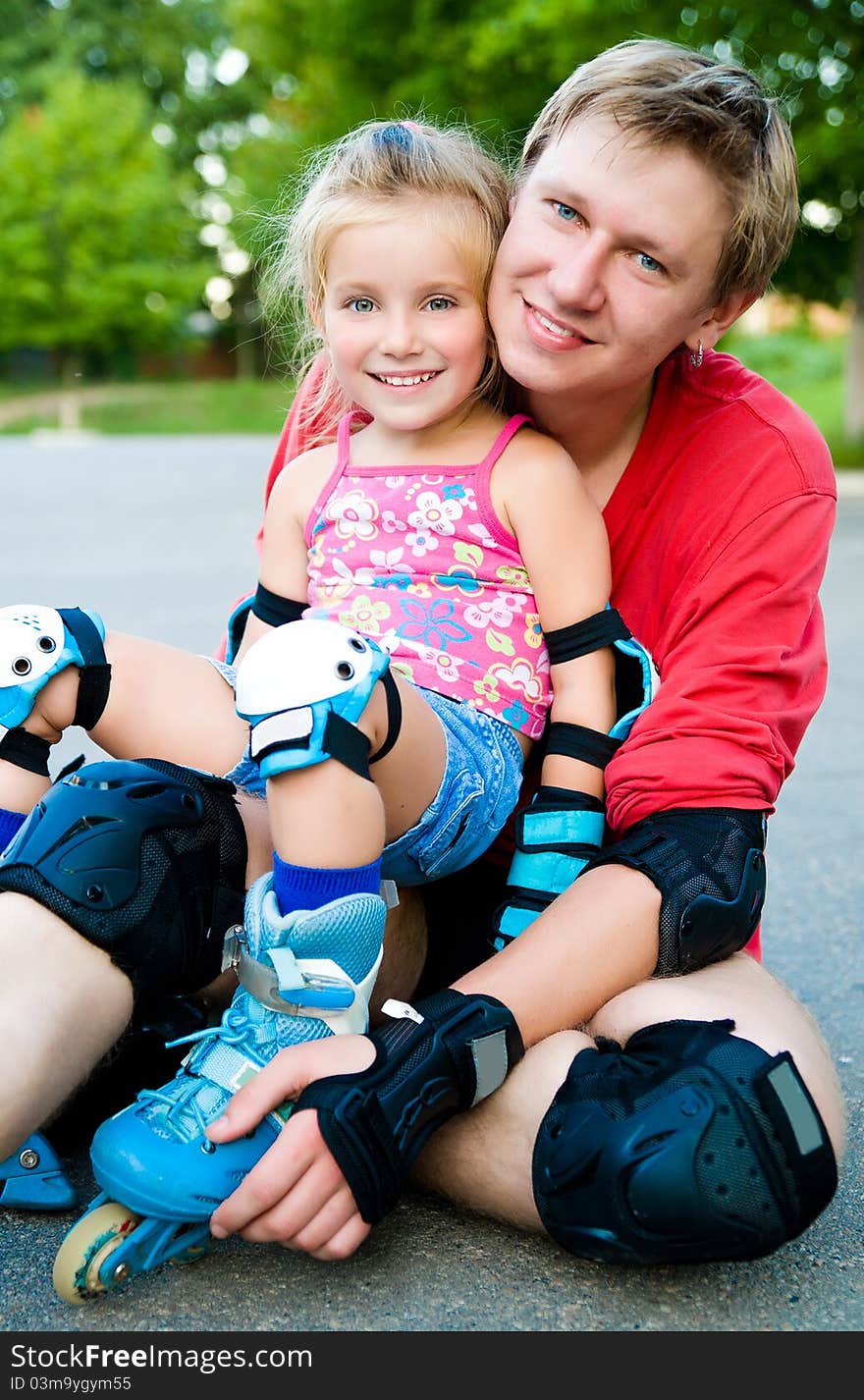 Dad With His Daughter On The Skates