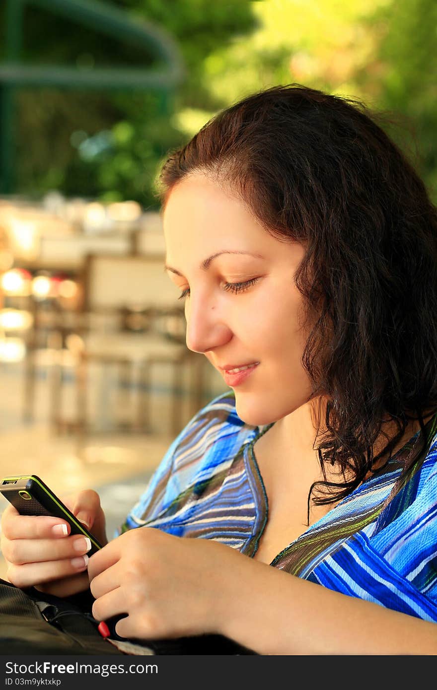 Girl looks at mobile phone