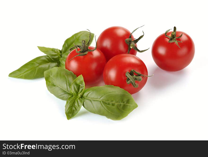 Leaves of basil and tomatoes