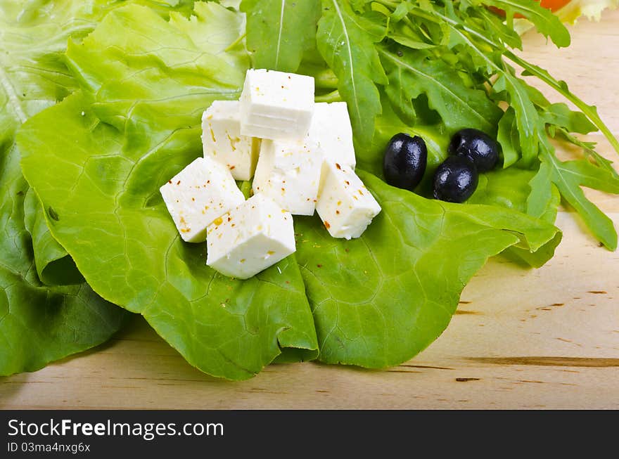 Goat's cheese with paprika, olives and ripe tomatoes