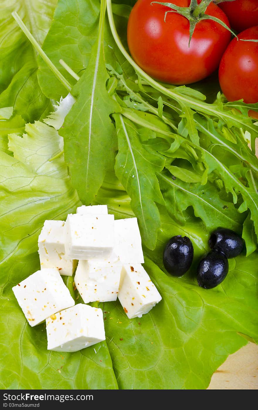 Goat's cheese with paprika, olives and ripe tomatoes