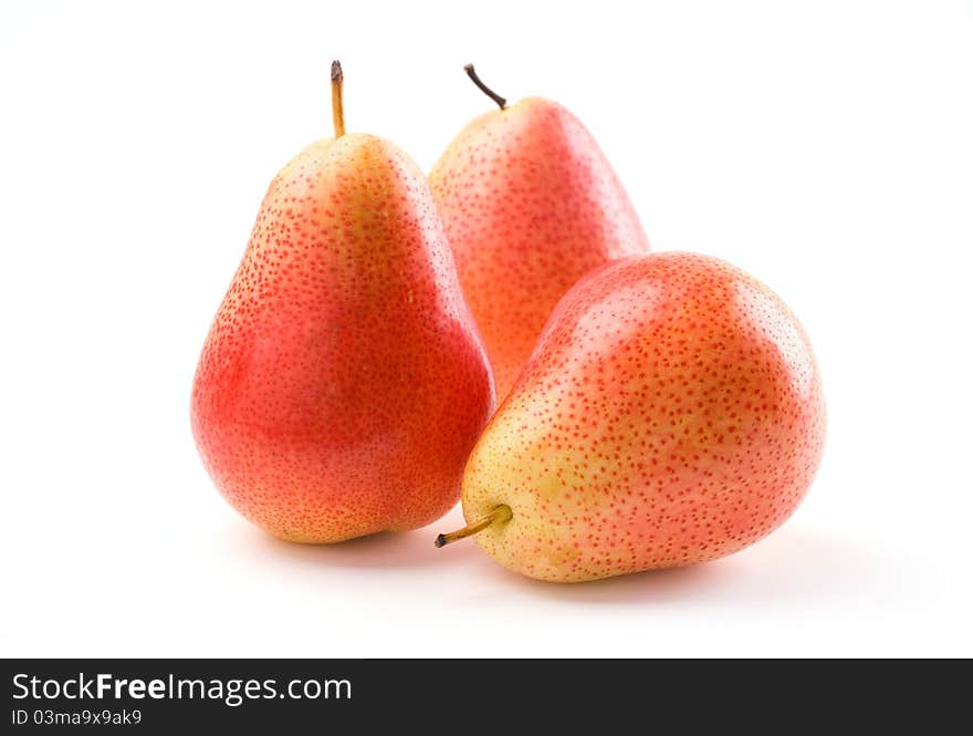 Three fresh pears on white