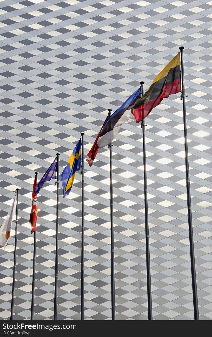 Various flags on modern architecture metal wall background. Various flags on modern architecture metal wall background