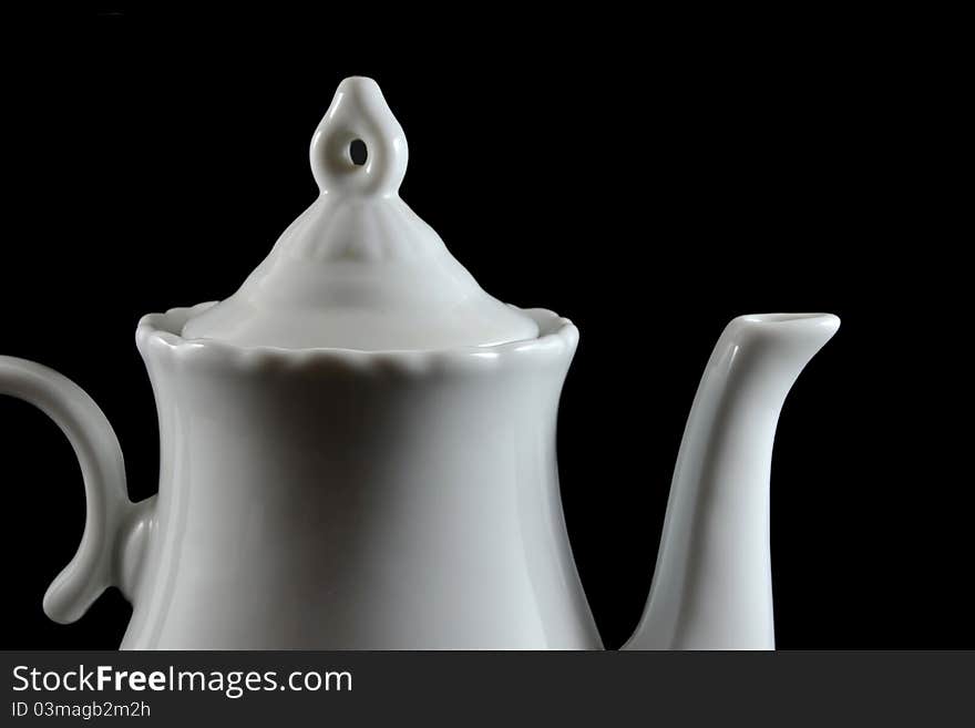 Detail of a white teapot made of porcelain. Detail of a white teapot made of porcelain