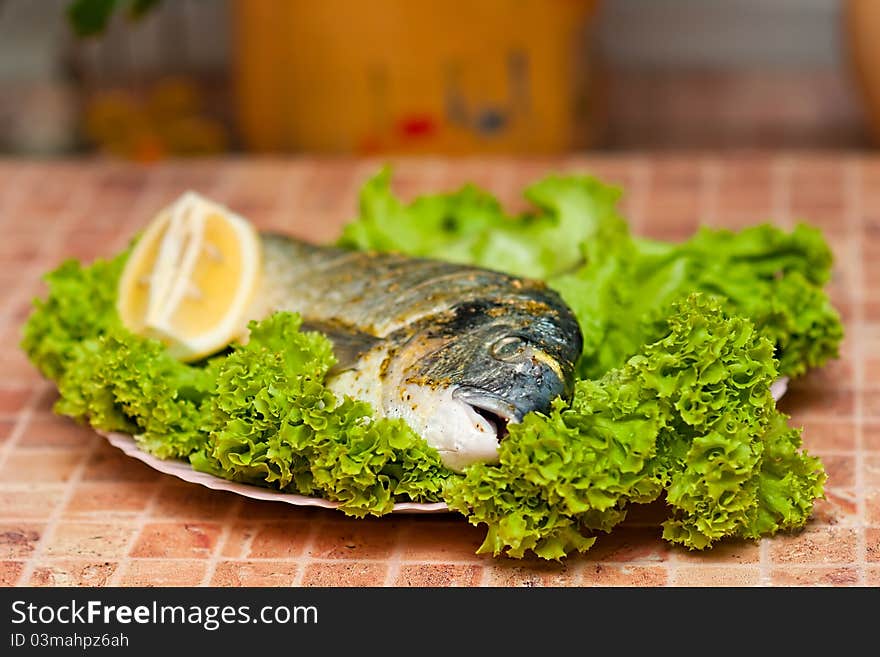 Whole griled dorada fish with vegetables