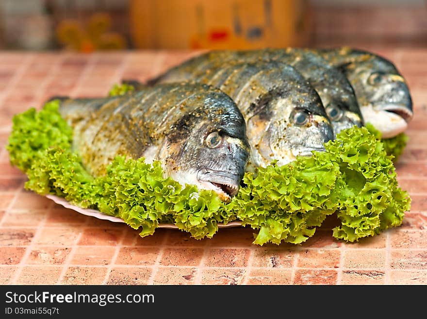 Whole griled dorada fish with vegetables