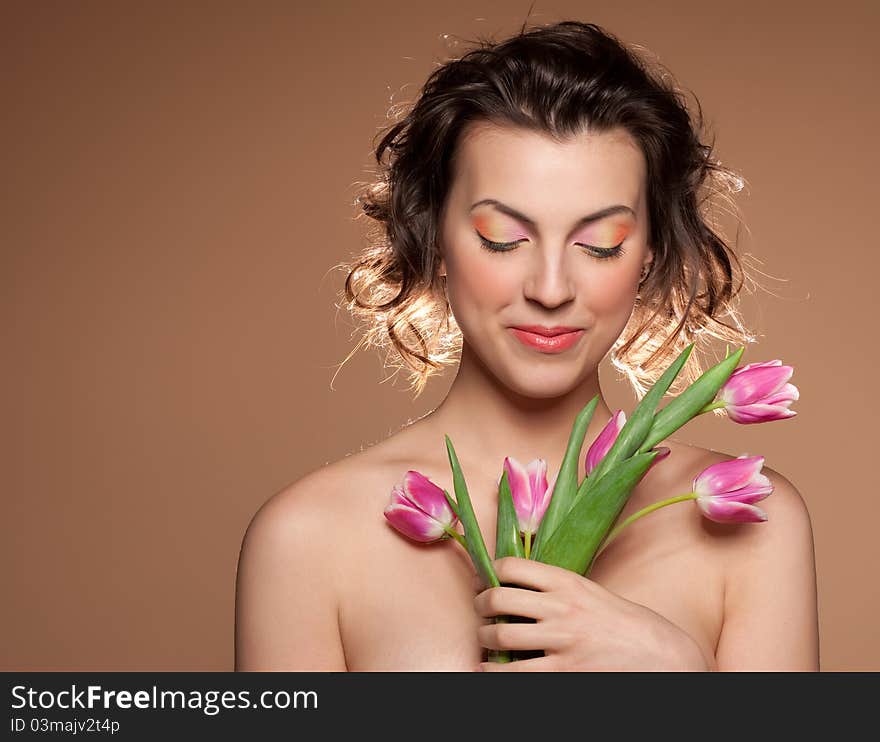 Portrait Of A Beautiful Girl With A Tulips