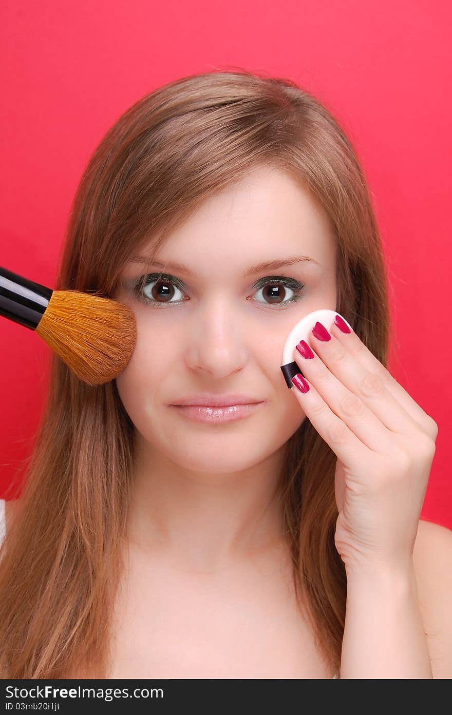 Portrait of a young woman on red