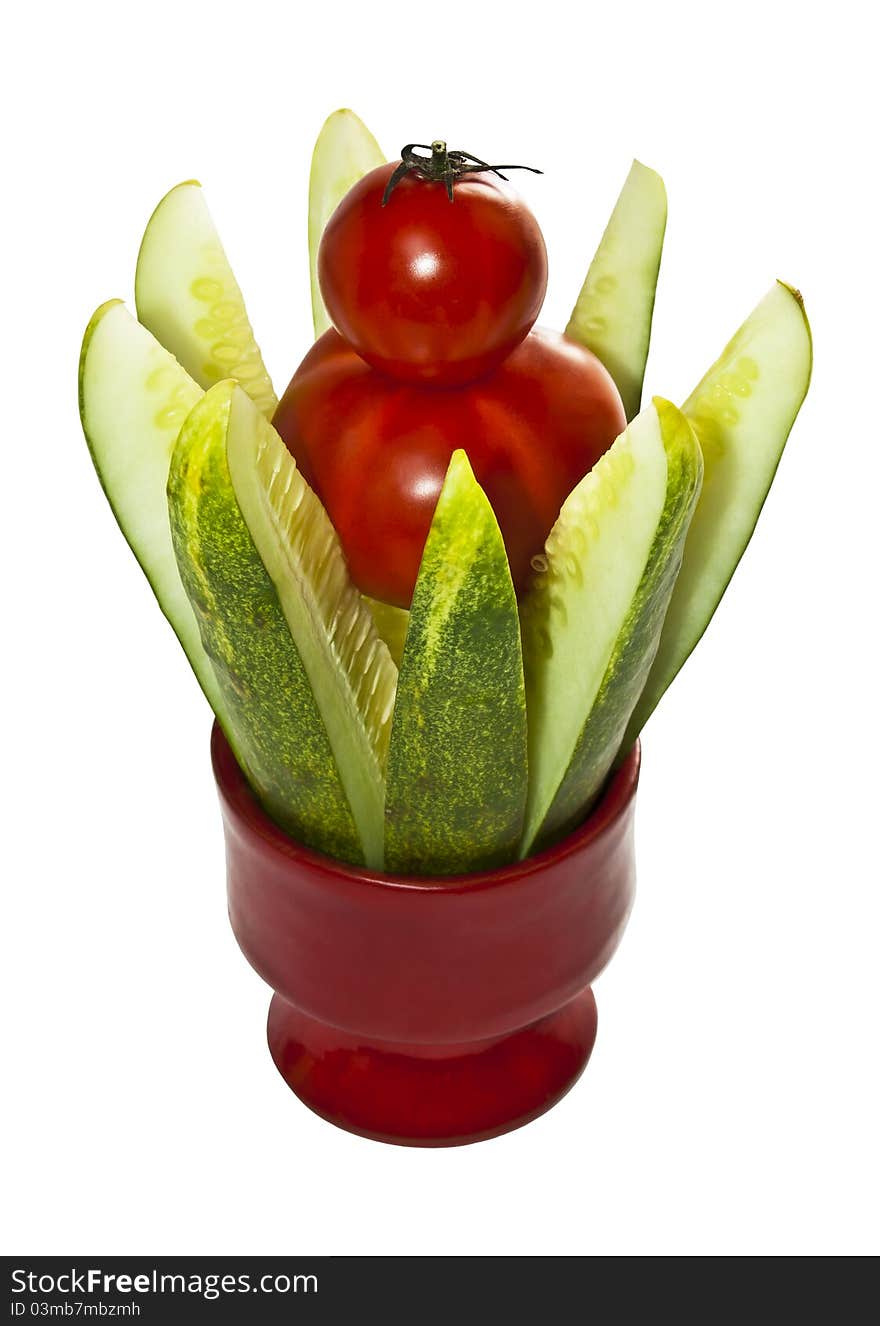 Cut the cucumber with tomatoes inserted in an isolated white background. Cut the cucumber with tomatoes inserted in an isolated white background.