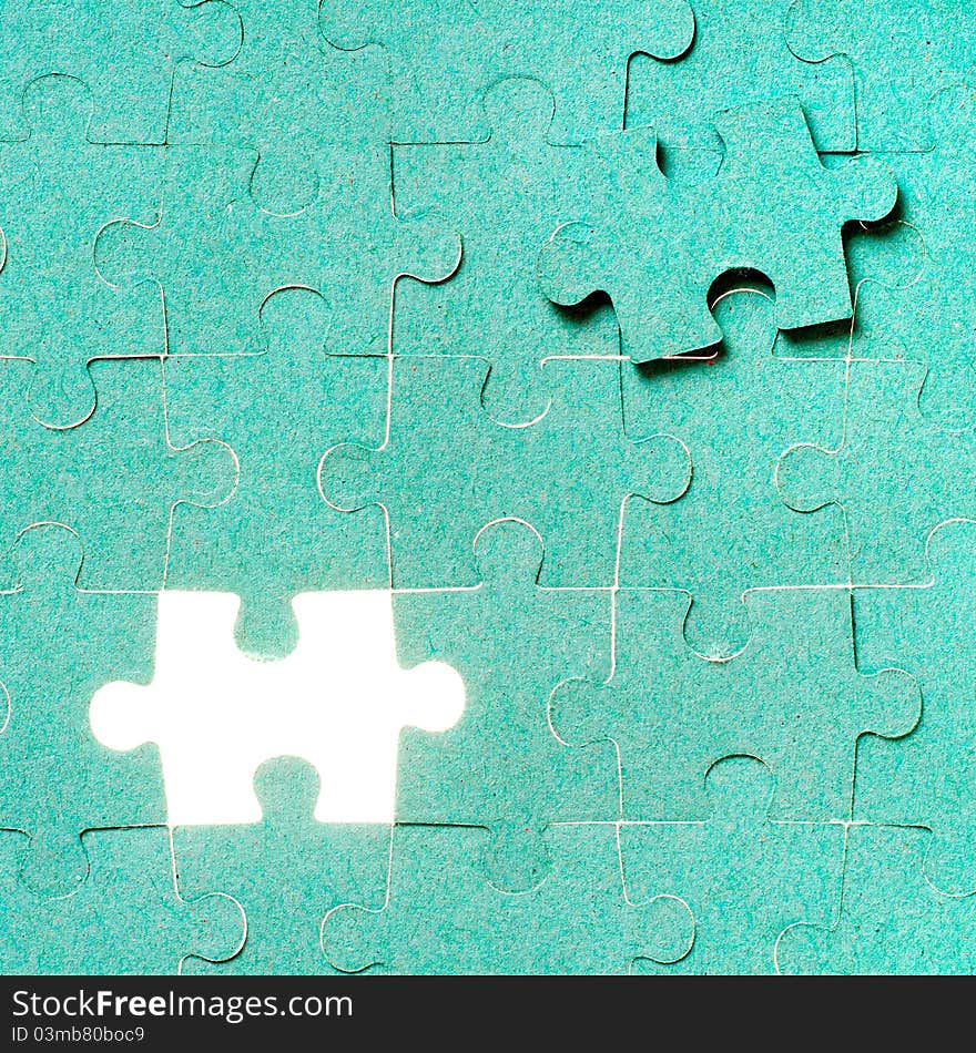 Green puzzle with missing piece