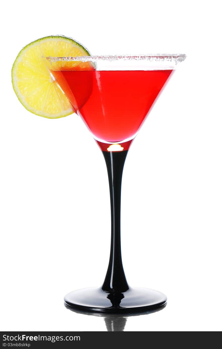 Red cocktail with lime isolated on white. Red cocktail with lime isolated on white