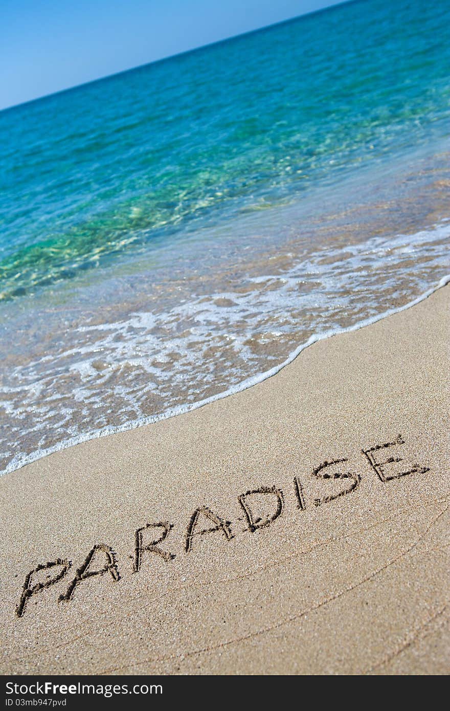 Paradise written on the sand