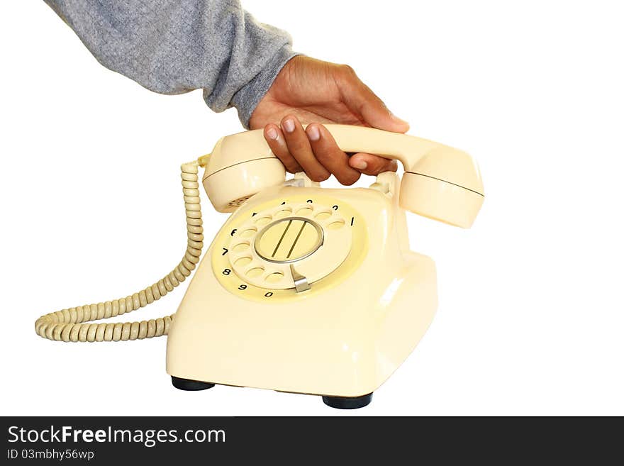 The hands of the men are picking up the traditional telephone. The hands of the men are picking up the traditional telephone.