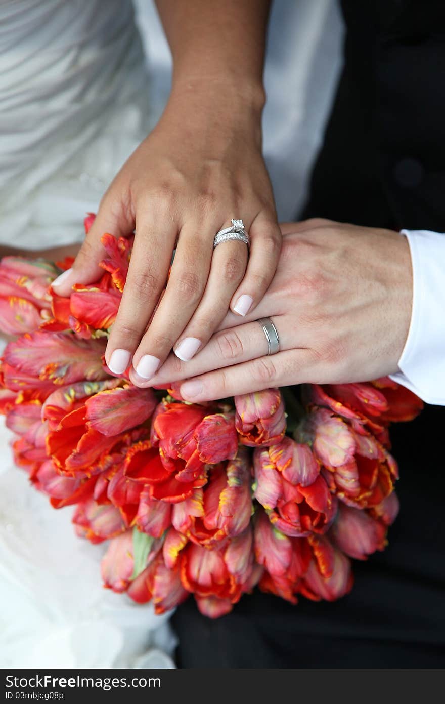 Wedding Hands and Rings on Bouquet