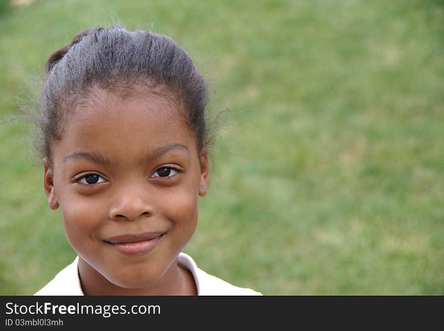 Young African-American girl at the park. Young African-American girl at the park