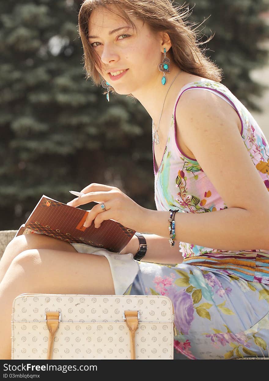 The image of a girl with a note-book