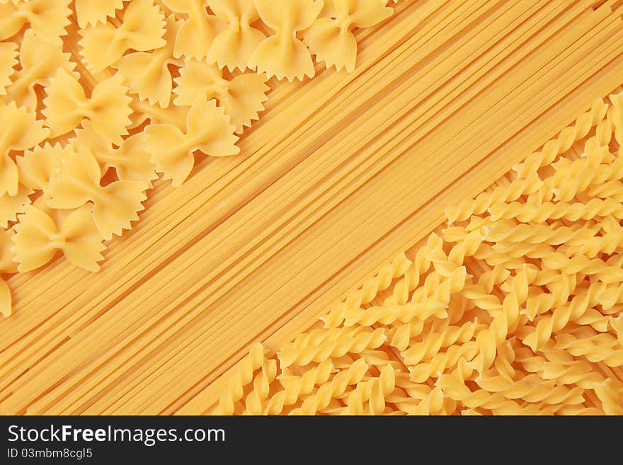 A collection of spaghetti, farfalle and rotini pasta. A collection of spaghetti, farfalle and rotini pasta