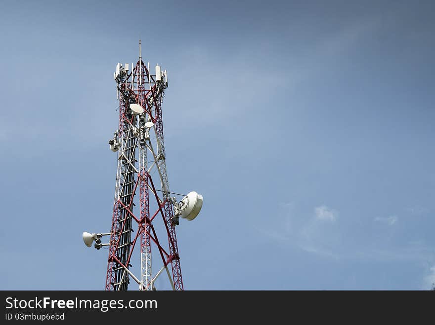 Radio communication tower against blue sky. Radio communication tower against blue sky