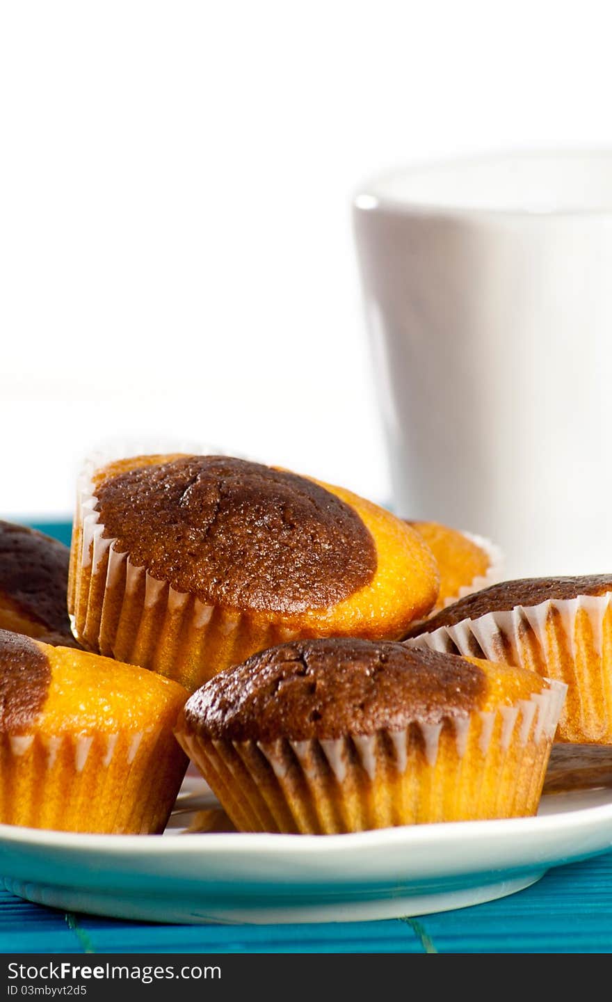 Plate Of Muffins With A Coup Of Milk