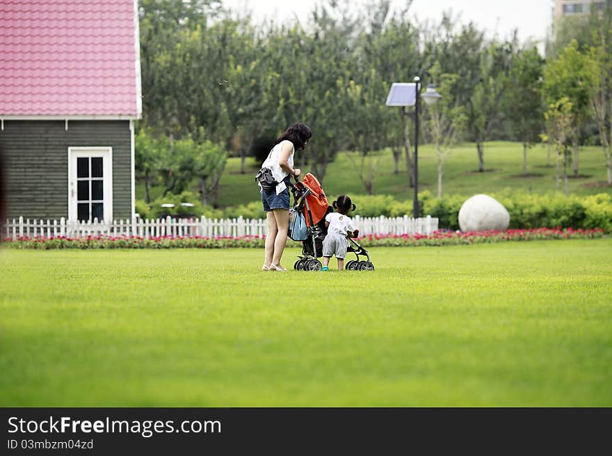 Mother and daughter on the lawn.