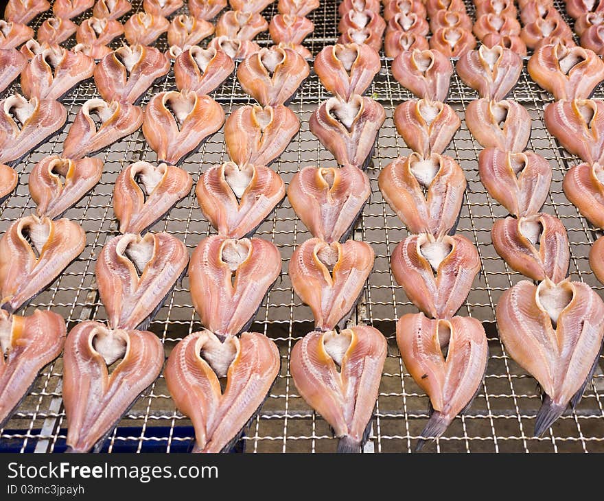 Sun dried fish, snakeskin fish on net