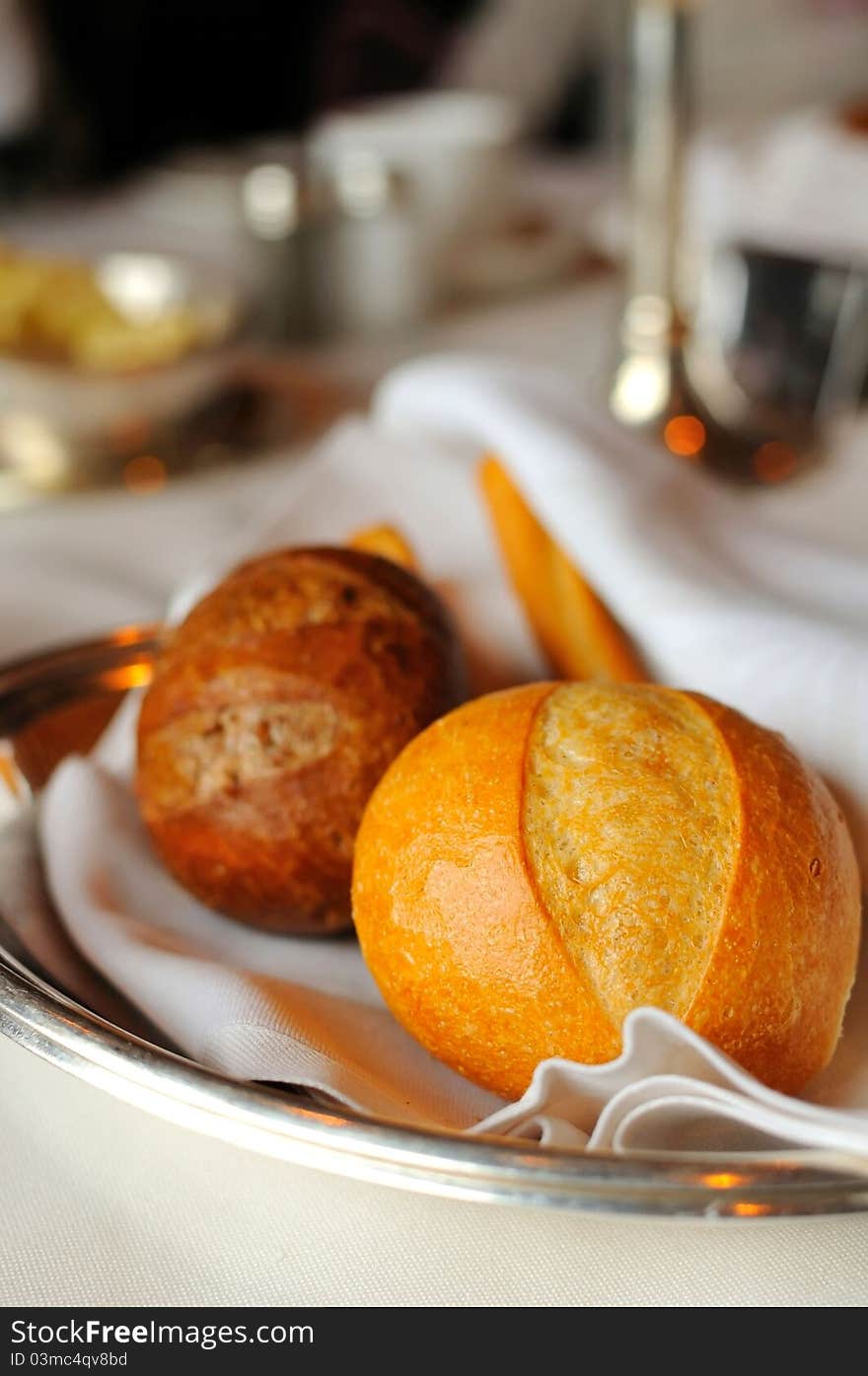 Closeup shot of single bread loaf in luxurious restaurant. Closeup shot of single bread loaf in luxurious restaurant.