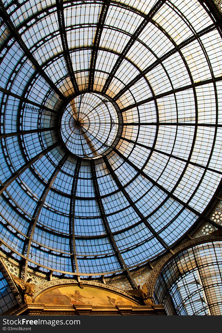 The Galleria Vittorio Emanuele II is a covered double arcade formed of two glass-vaulted arcades at right angles intersecting in an octagon, prominently sited on the northern side of the Piazza del Duomo in Milan. The Galleria Vittorio Emanuele II is a covered double arcade formed of two glass-vaulted arcades at right angles intersecting in an octagon, prominently sited on the northern side of the Piazza del Duomo in Milan.