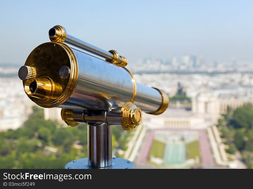 View of a telescope from high up on the Eiffel Tower. View of a telescope from high up on the Eiffel Tower