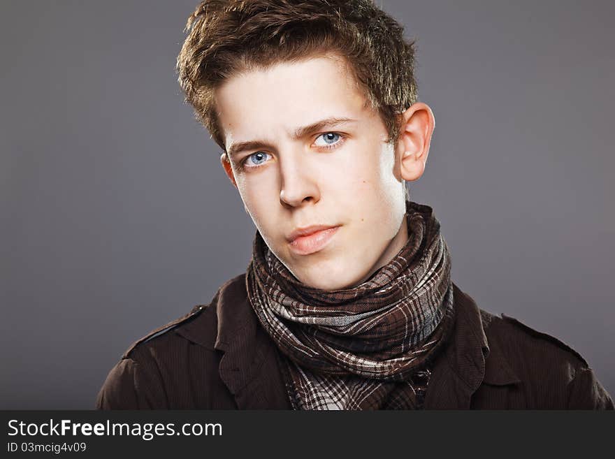 Attractive young man wearing elegant shirt and scarf. Attractive young man wearing elegant shirt and scarf