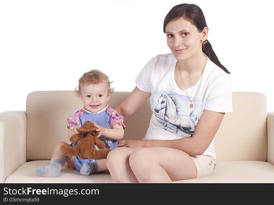 Nice mom with her daughter on a white. Nice mom with her daughter on a white