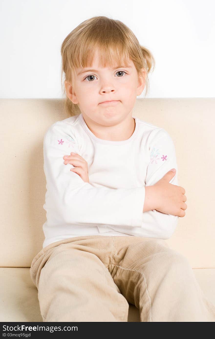 Portrait of a little girl on sofa